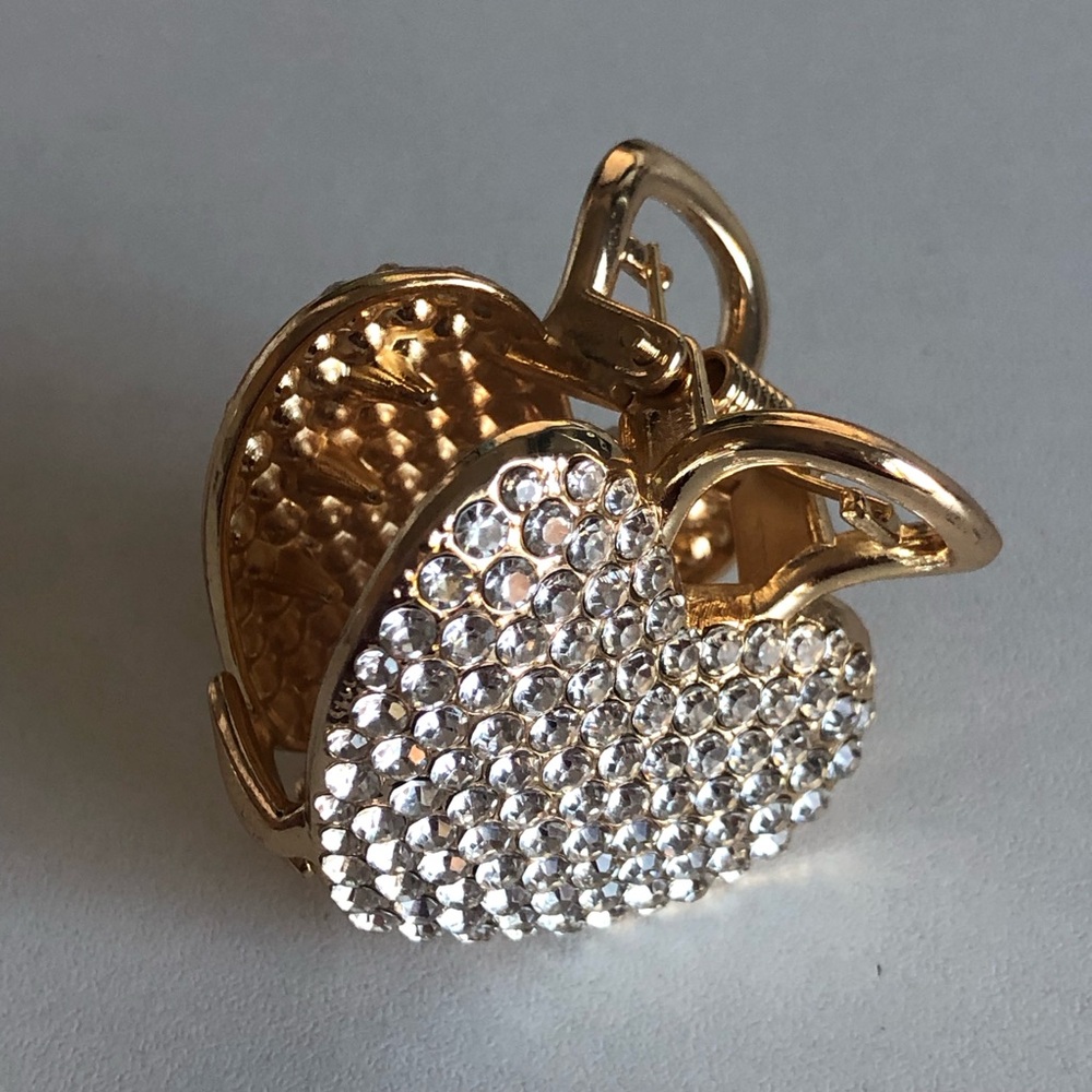 Gold-toned hair claw clip with rhinestones.